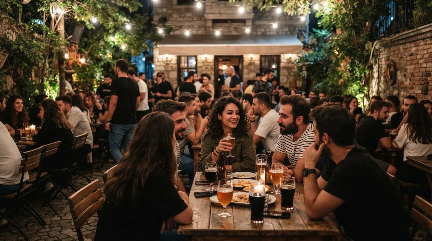 the hidden back garden at Joker No.19 on Beşiktaş Caddesi, crowded with young drinkers, craft beers and string-lit tables after dark